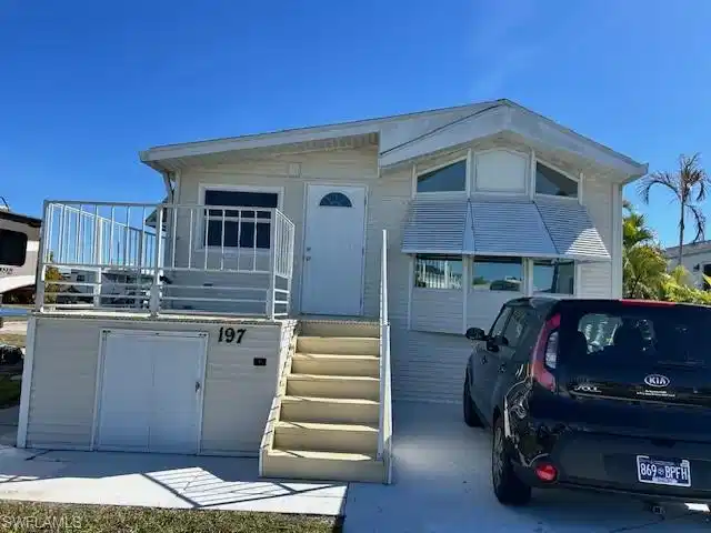 Image 1: View of front of house with stairway