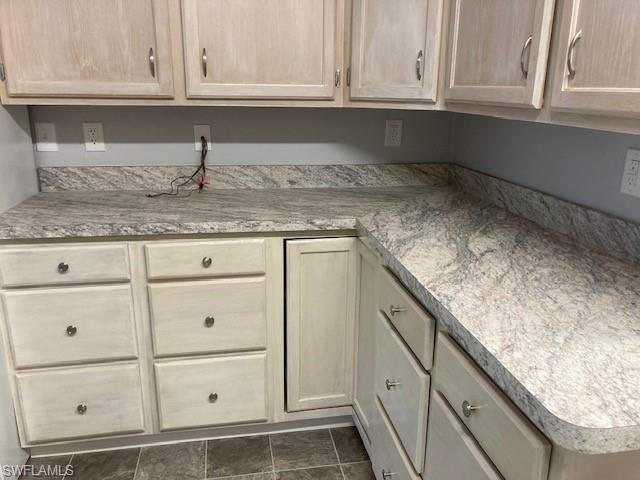 Image 4: Kitchen featuring light brown cabinetry and light countertops