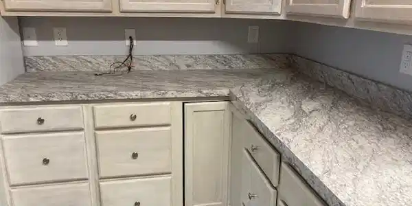 Image 4: Kitchen featuring light brown cabinetry and light countertops