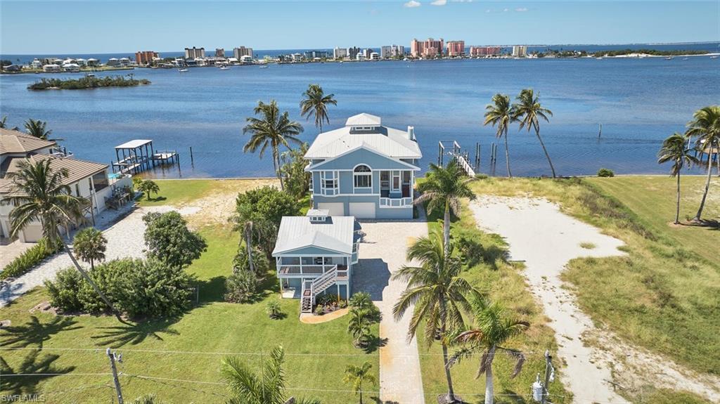 Image 3: View of urban area featuring a large body of water