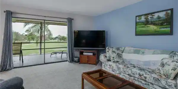 Image 4: View of carpeted living room