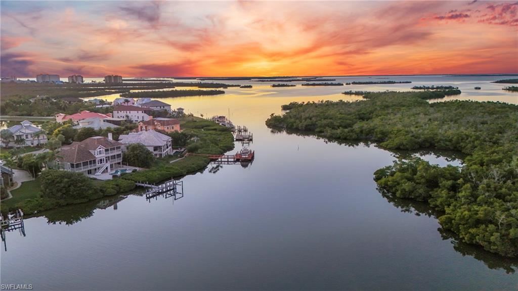 Image 1: Aerial view at dusk of a water view