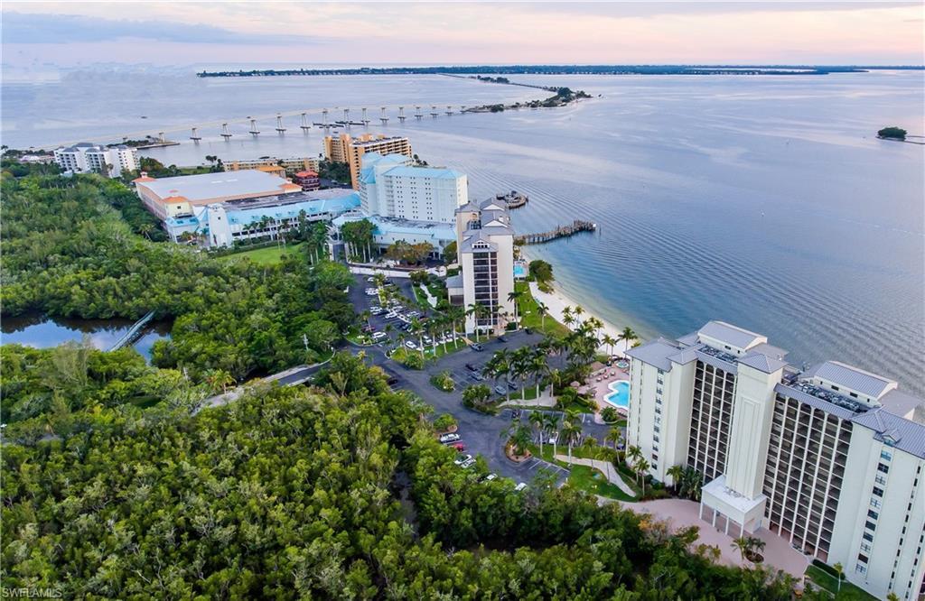 Image 2: Aerial view at dusk featuring a water view