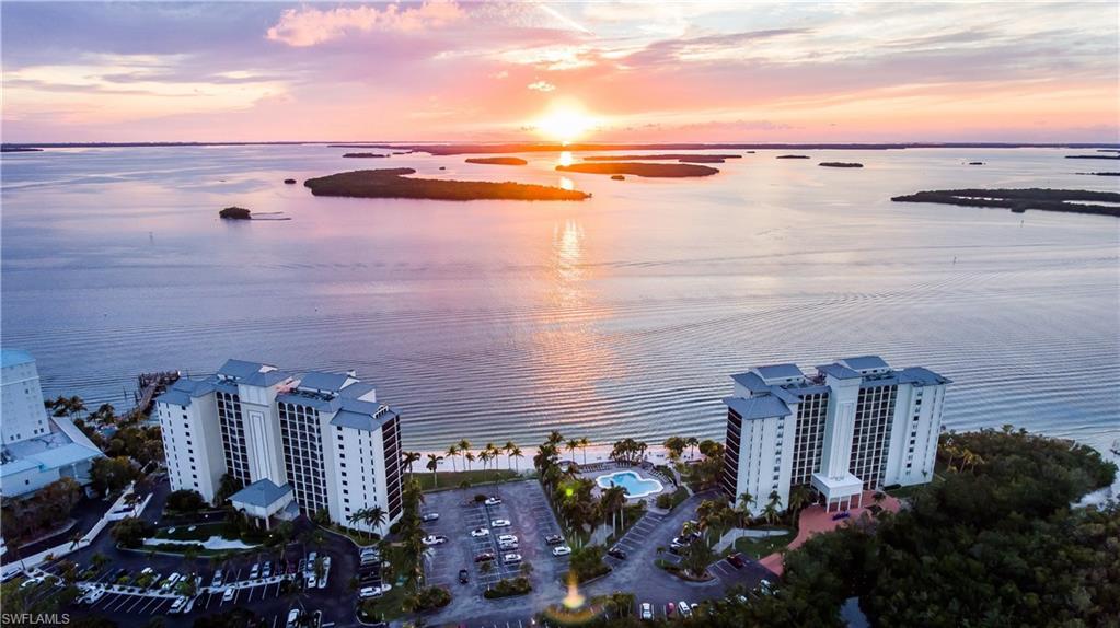 Image 3: Aerial view at dusk with a water view