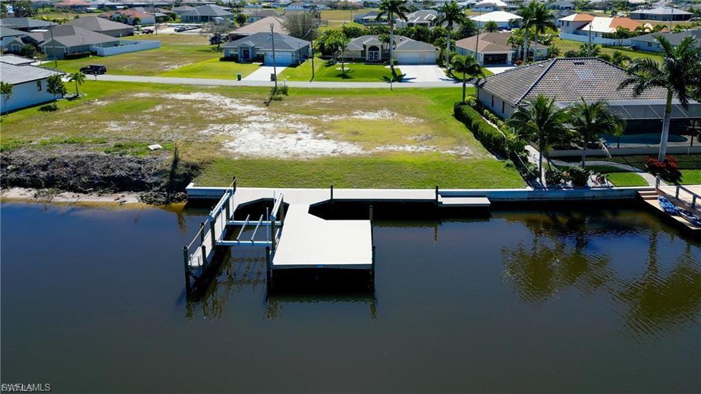 Image 1: Composite dock built in 2022, 10,000 lb lift and boat slip.