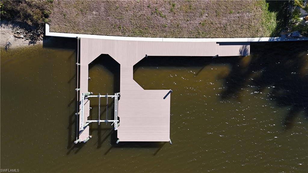 Image 3: Composite dock, 10,000 lb lift and boat slip for larger boat.