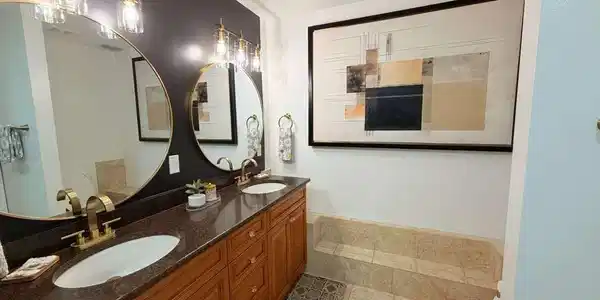 Image 4: Bathroom featuring double vanity and light tile patterned floors