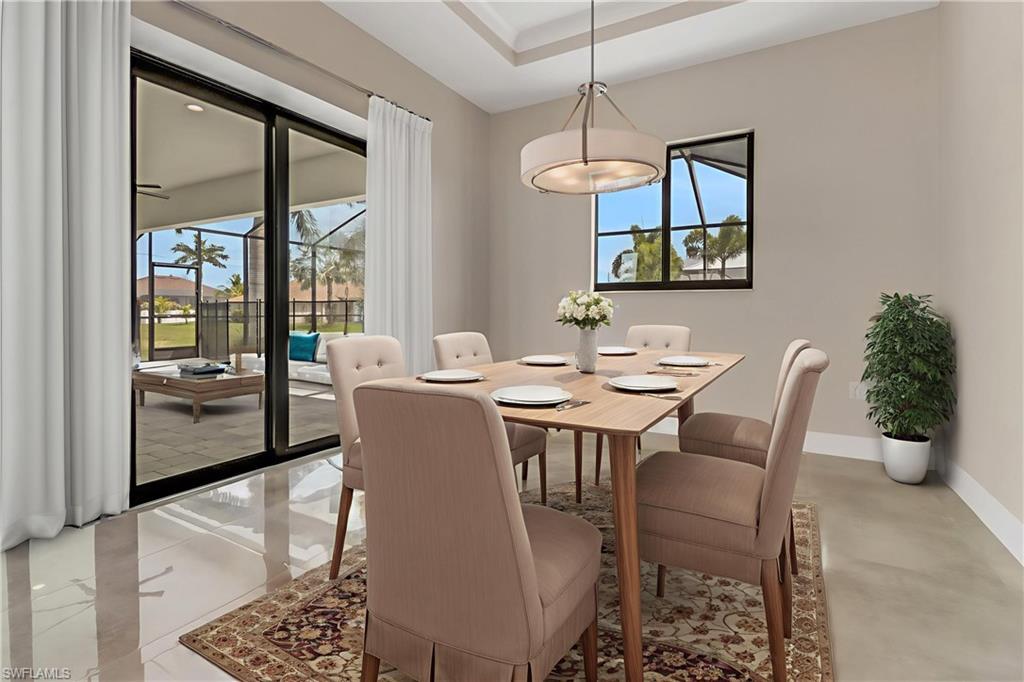 Image 3: Dining space featuring healthy amount of natural light and concrete flooring