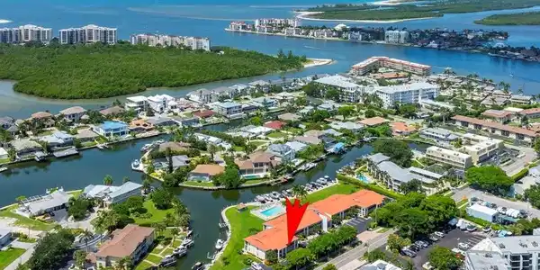 Image 4: Aerial view of property's location featuring a nearby body of water
