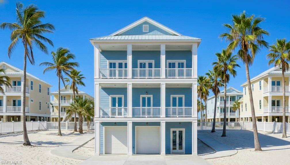 Image 2: Front 3D rendering home with 2 attached garages & outdoor decks- virtually enhanced