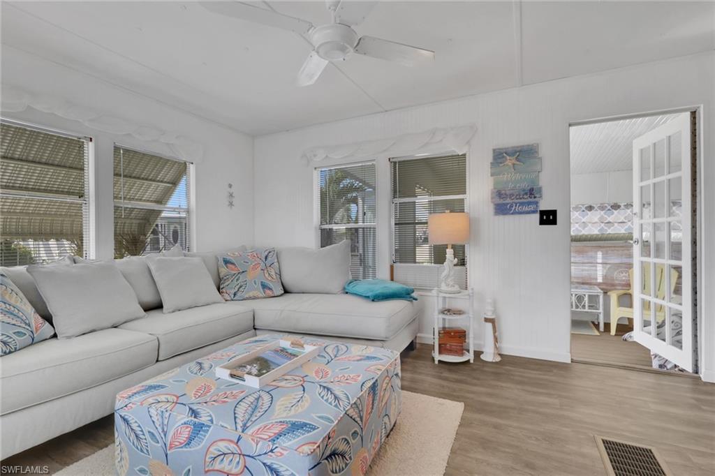 Image 2: Living room featuring a ceiling fan and wood finished floors