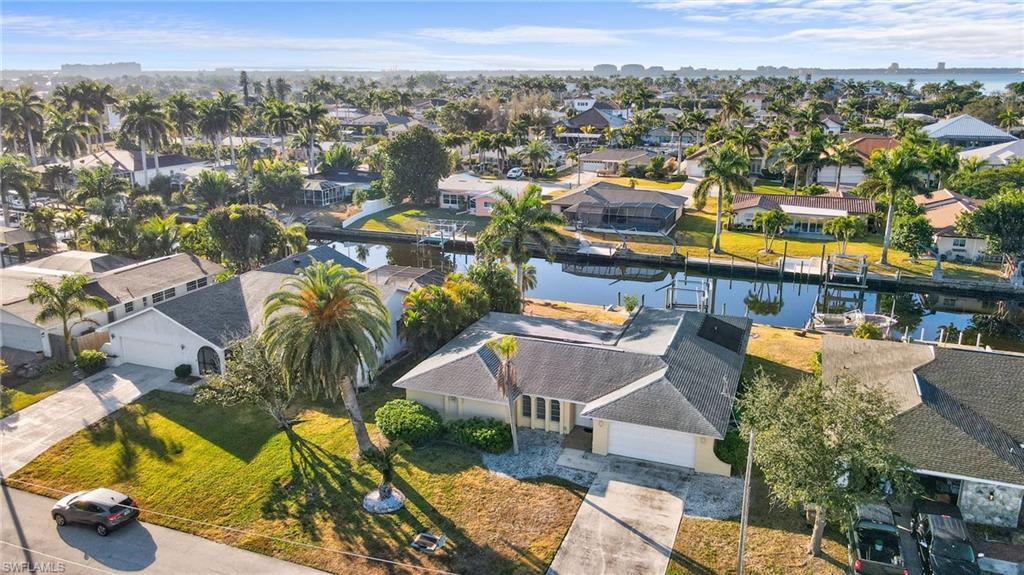 Image 2: Areial view of the front of the home, direct access canal and close proximity to the Caloosahatchee River.
