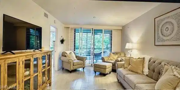 Image 2: Living area featuring wood-type flooring