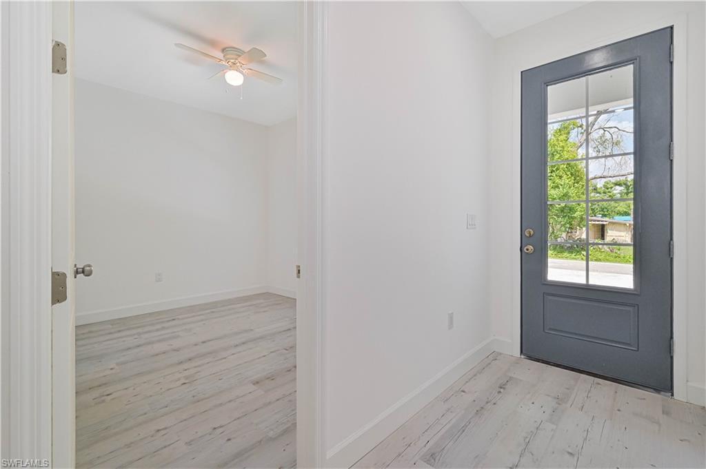 Image 2: Foyer entrance featuring ceiling fan and light hardwood / wood-style flooring