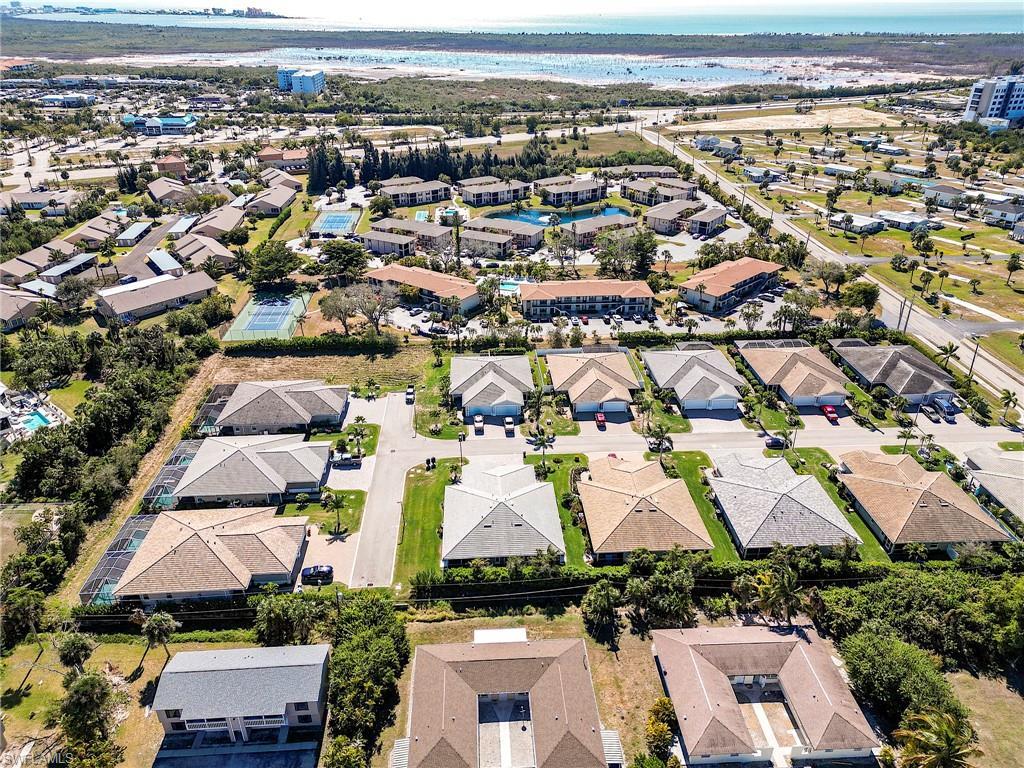 Image 3: Aerial view of property and surrounding area featuring nearby suburban area