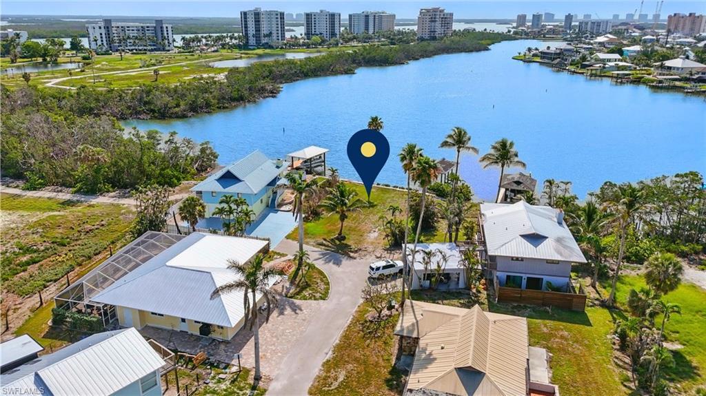 Image 3: View of urban area featuring a large body of water VIRTUALLY ENHANCED