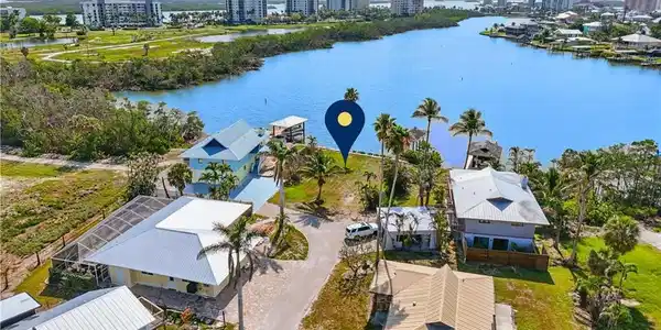 Image 3: View of urban area featuring a large body of water VIRTUALLY ENHANCED