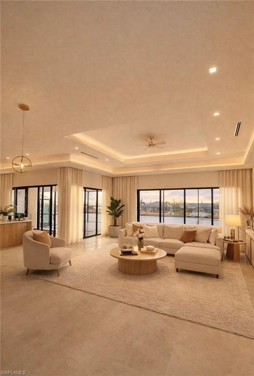 Image 2: Living room featuring a raised ceiling, plenty of natural light, ceiling fan, and recessed lighting (Rendered photo)