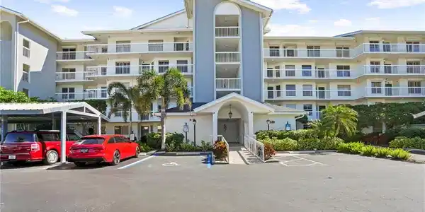 Image 3: View of apartment building / complex with uncovered parking