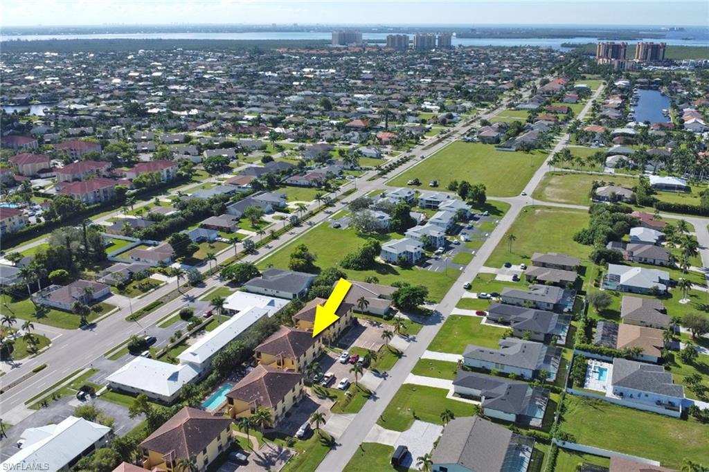 Image 4: Aerial view of condo building with Tarpon Point and Cape Harbour in the distance