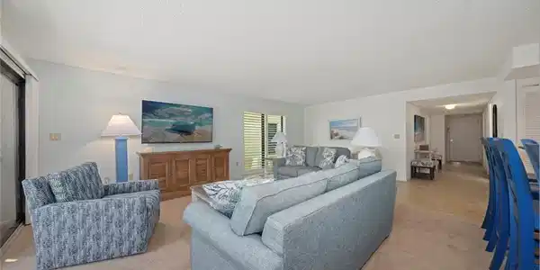 Image 4: Living room with carpet and a textured ceiling