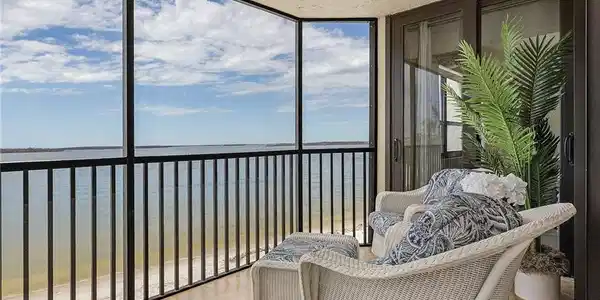 Image 3: Sunroom / solarium with a water view