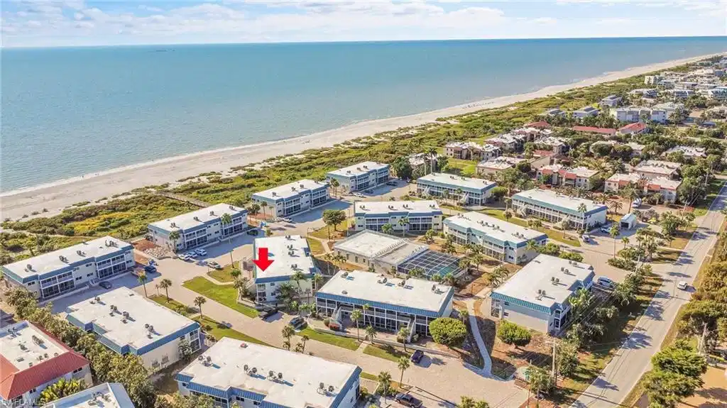 Image 1: Just a few steps carry you from your front door to the white-sand beaches of Sanibel Island, where mornings begin with seashells glittering in the tide and evenings melt into watercolor sunsets.