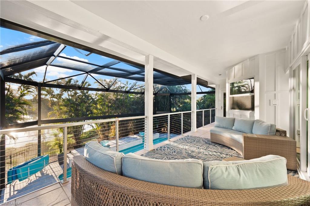 Image 3: Large balcony overlooking the expansive pool area!!