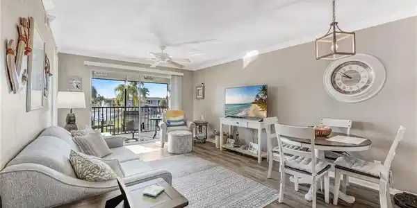 Image 3: Fabulous views of the lake and fountain from your living area.  Beautiful luxury vinyl floors.