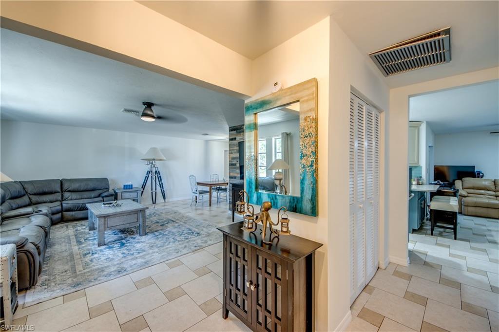 Image 4: Living area featuring ceiling fan and baseboards