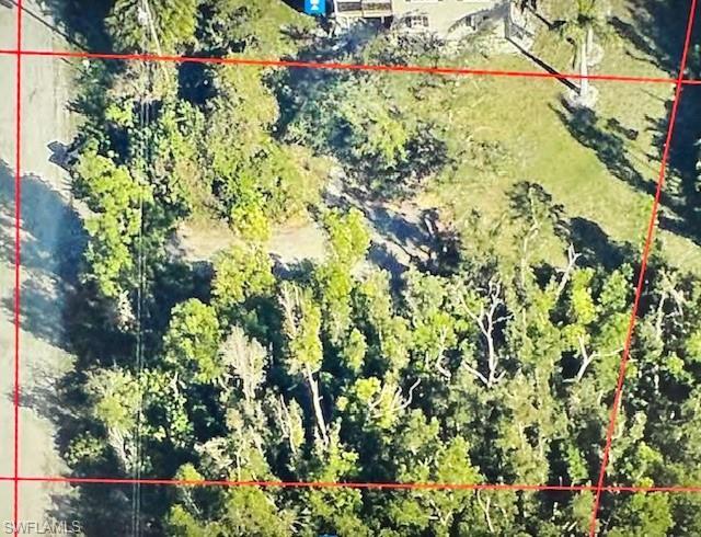 Image 4: Aerial view of property and surrounding area featuring property boundaries highlighted