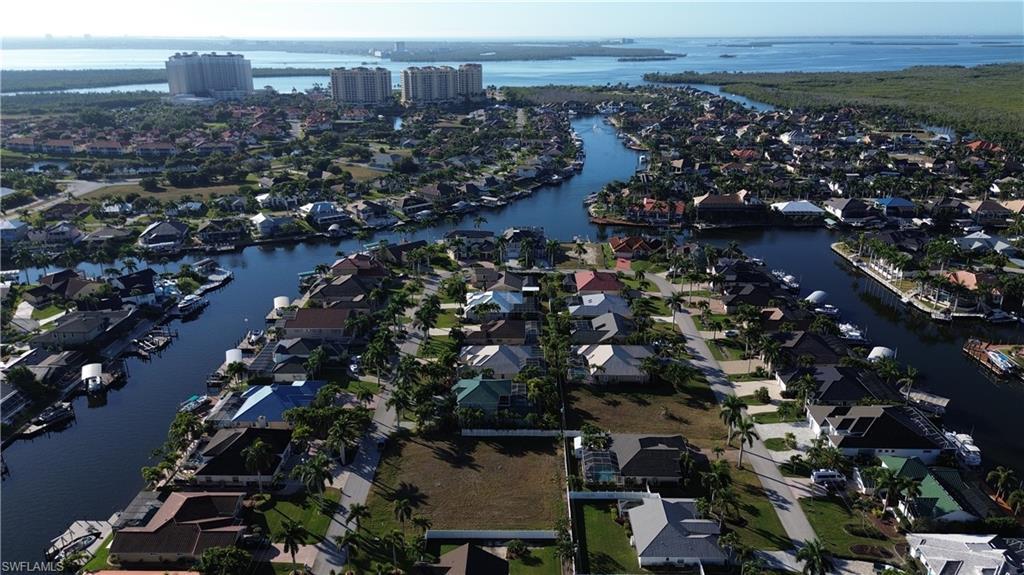 Image 2: Aerial view of property's location featuring nearby suburban area