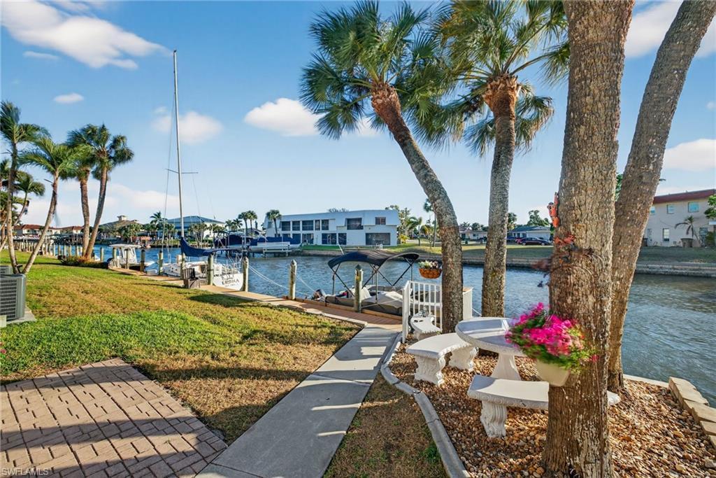 Image 1: Community dock on intersecting sailboat-access canals &mdash; direct boating route to the Caloosahatchee River and Gulf of Mexico