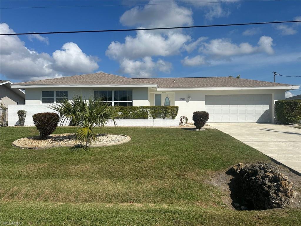 Image 1: Single story home with concrete driveway, an attached garage, stucco siding, and a front yard