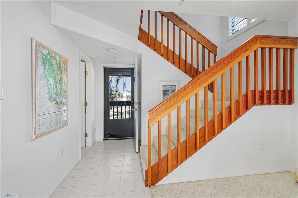 Image 4: Foyer with plenty of natural light and light tile patterned flooring