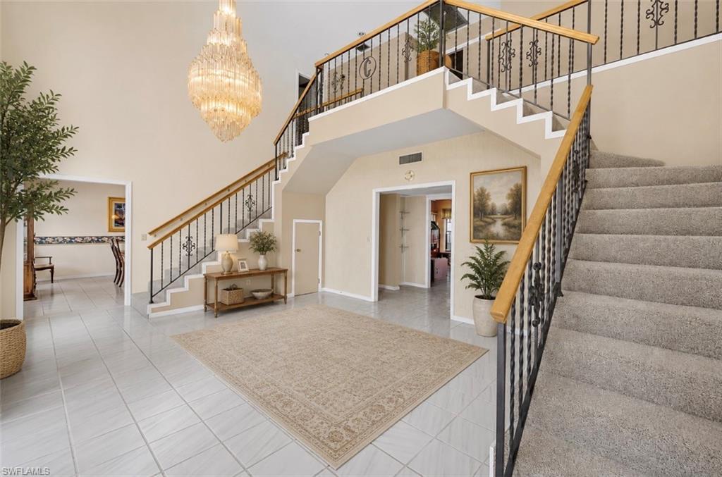 Image 4: Entryway staged with furniture