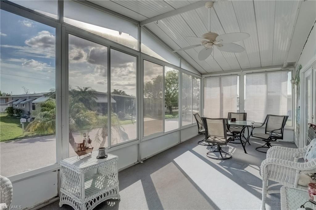 Image 4: Sunroom / solarium with ceiling fan, vaulted ceiling, and outdoor dining area