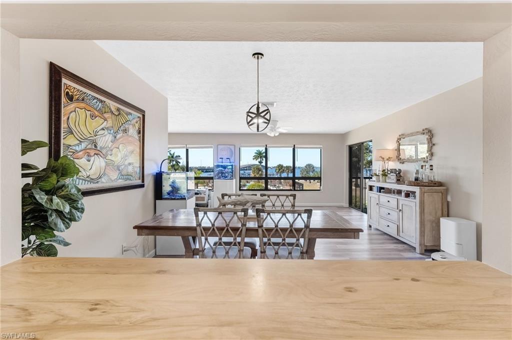 Image 3: An open flow between the living and dining areas makes entertaining feel effortless.