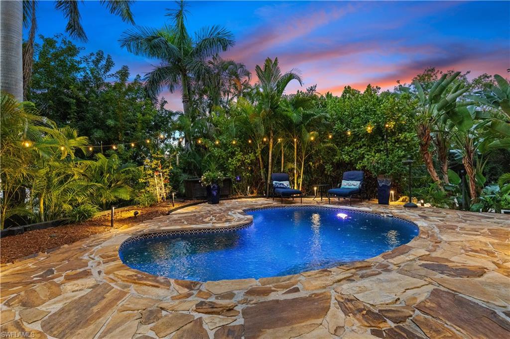 Image 2: Pool at dusk featuring an outdoor pool and a patio area