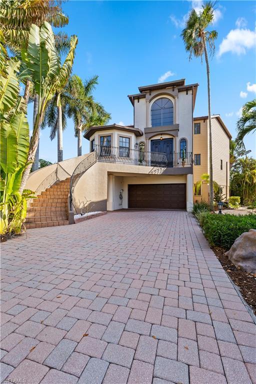 Image 3: Mediterranean / spanish home with stucco siding, a balcony, driveway, and a garage