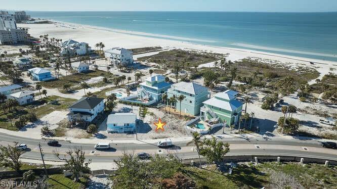 Image 2: Bird's eye view featuring a beach view and a water view