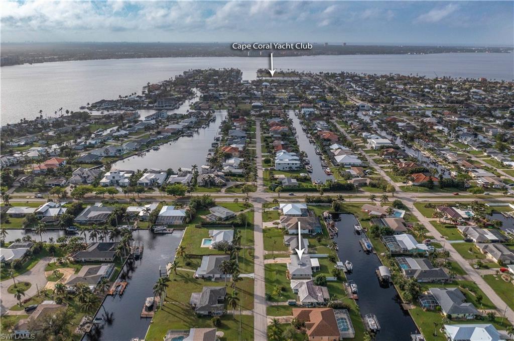 Image 2: Bird's eye view featuring a view of the home, it's neighborhood, and the Caloosahatchee River