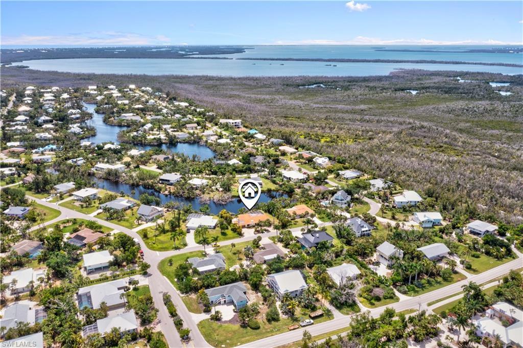 Image 3: Expansive aerial perspective highlighting the home&rsquo;s prime location in Gumbo Limbo and proximity to Sanibel&rsquo;s beaches.