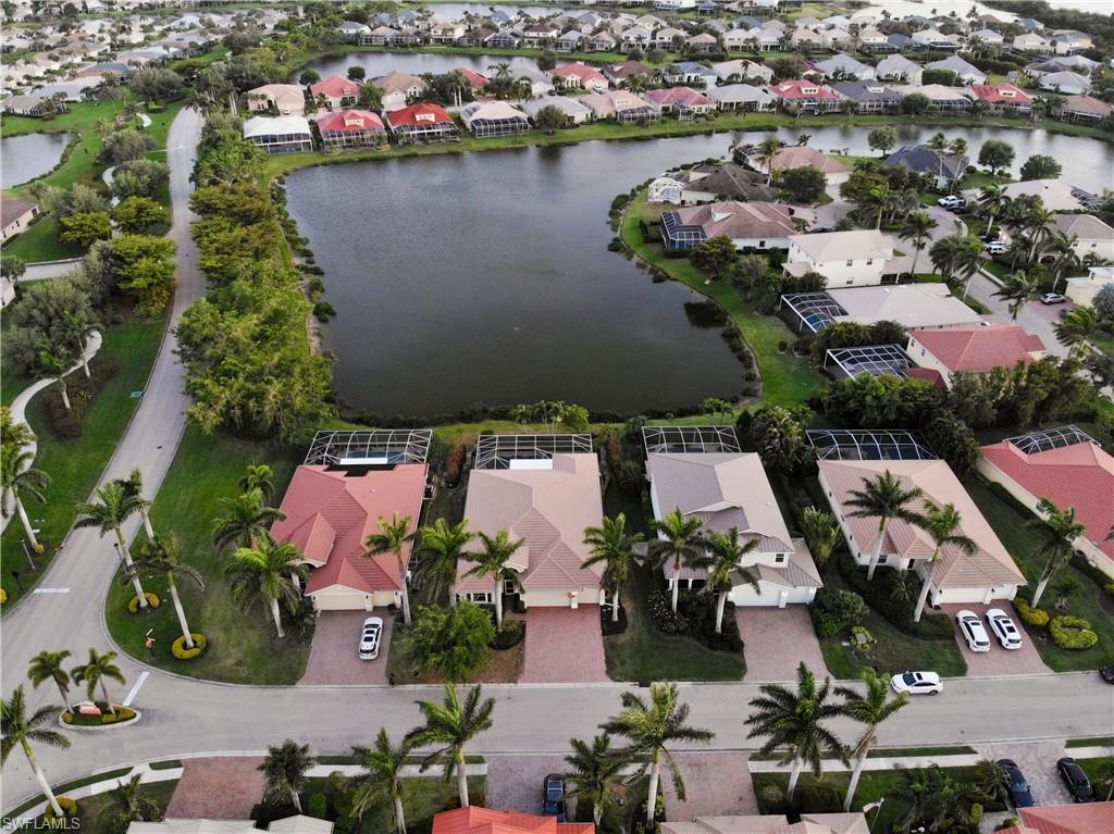 Image 1: Drone / aerial view featuring a water view and a residential view