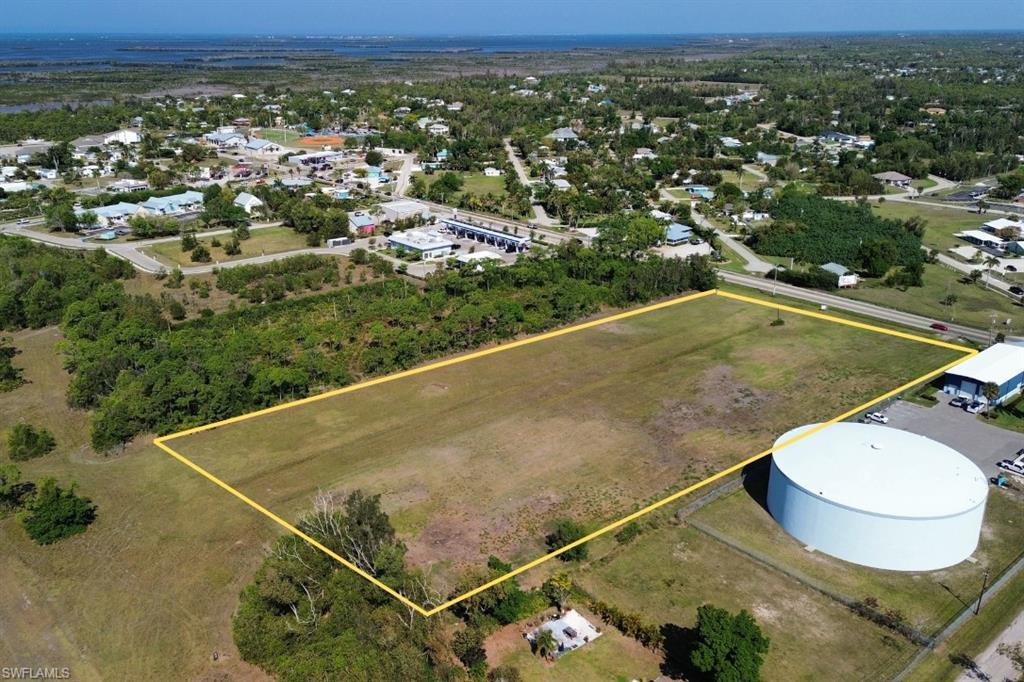 Image 3: Expansive cleared land parcel outlined in yellow