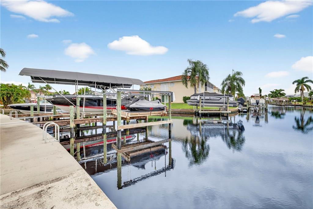 Image 2: unit has deed dock with boat lift.  No Bridges to the gulf