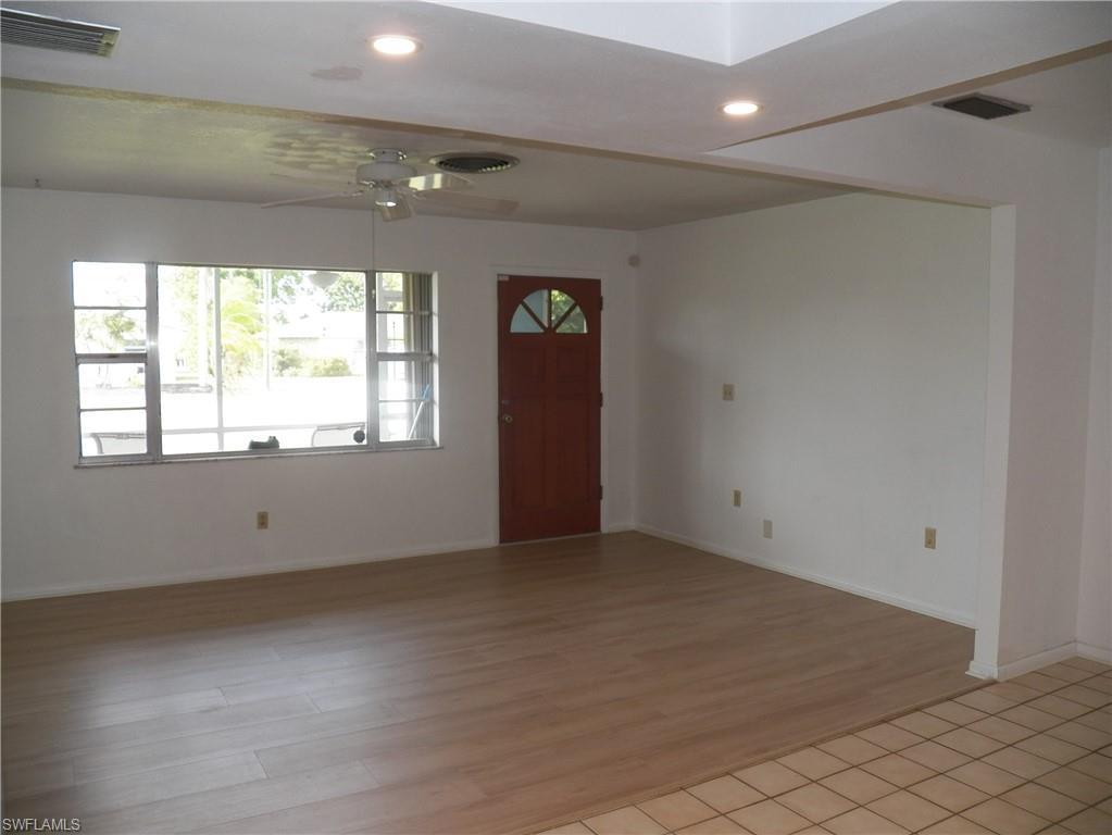 Image 4: Front door and living room