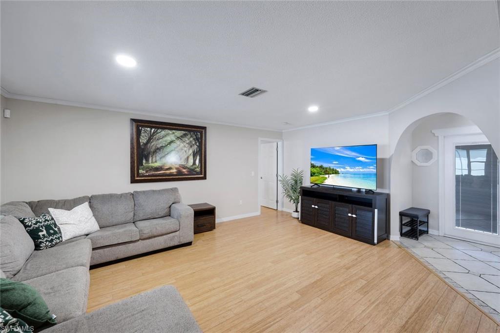 Image 4: Light wood-finish flooring complements neutral wall tones