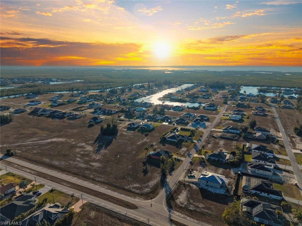Image 3: Aerial view of residential area with a large body of water