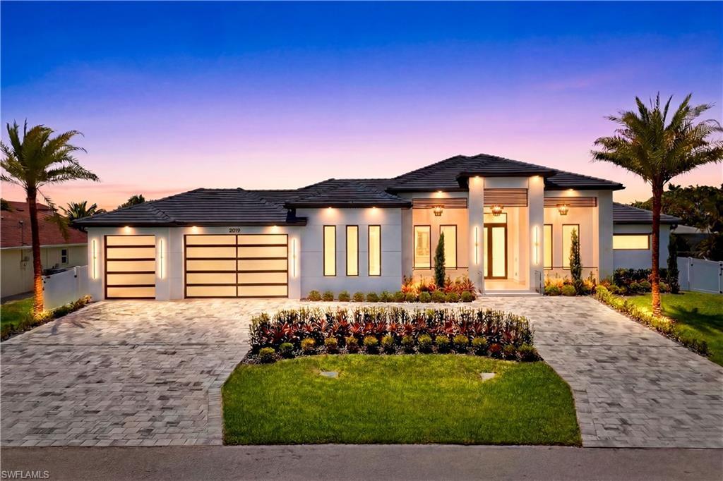 Image 1: Rare triple-lot modern estate in the heart of SW Cape Coral w/ 4,861 total sq ft